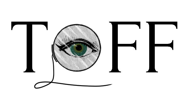TOFF logo with monocle and Egyptian eye makeup